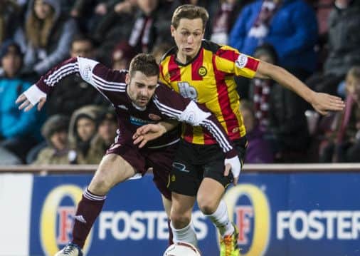 Scott Robinson, pictured here in action against Partick, will miss the clash with Rangers at Ibrox. Picture: TSPL