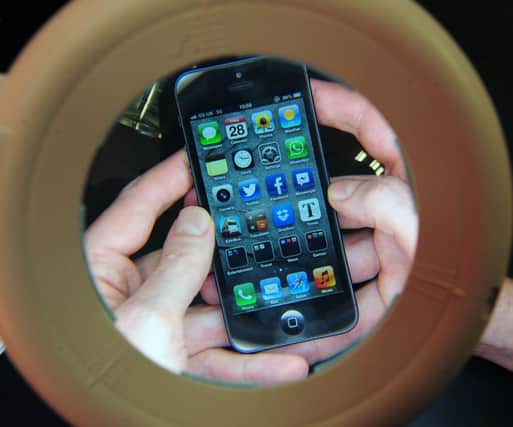 Smart phones keep us better connected to our friends. Picture: Ian Rutherford