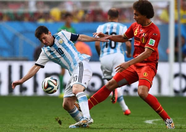 Lionel Messi and Axel Witsel clash for the ball. Picture: Getty
