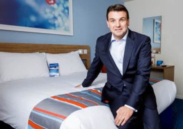 Peter Gowers, in a refurbished Travelodge bedroom, has overseen the revamp of the chain
