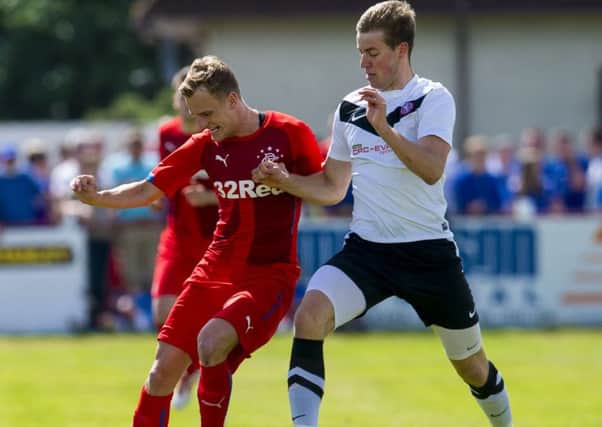 Rangers' Dean Shiels (left) is shackled by Brora's Martin Maclean. Picture: SNS