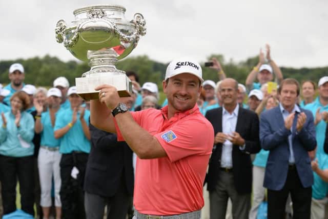 Graeme McDowell lifts the trophy after his victory at the Alstom Open de France yesterday. Picture: Getty
