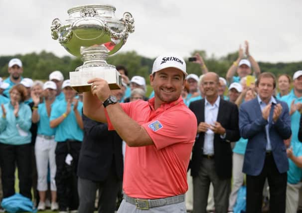Graeme McDowell lifts the trophy after his victory at the Alstom Open de France yesterday. Picture: Getty