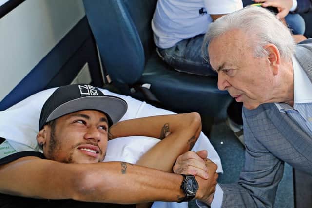 Neymar with the president of the Brazilian Football Confederation (CBF) Jose Maria Marin, before heading home. Picture: Getty