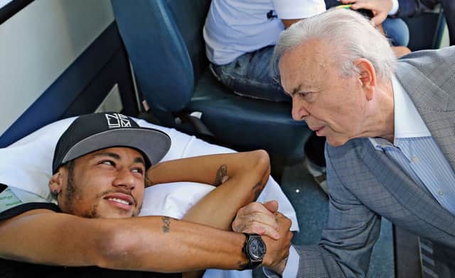 Neymar with the president of the Brazilian Football Confederation (CBF) Jose Maria Marin, before heading home. Picture: Getty