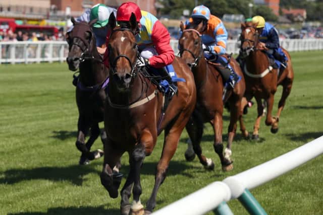 Graham Lee, centre, wins on Testa Rossa at Ayr. Picture: John Grossick