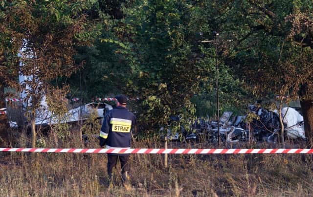 The crash site is examined near the village of Topolow in Poland. Picture: AP