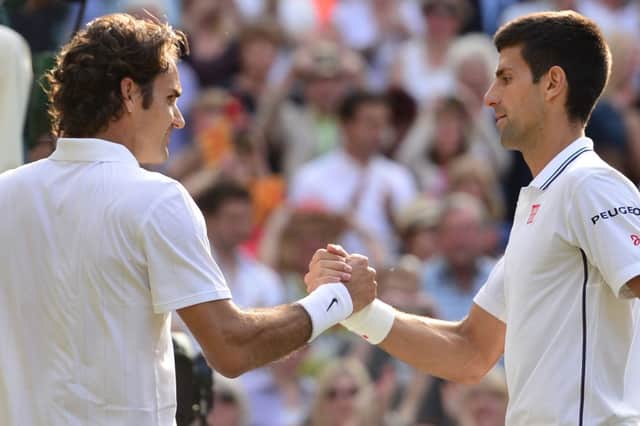 Novak Djokovic, right, shakes hands with Roger Federer after their five-set final. Picture: Getty