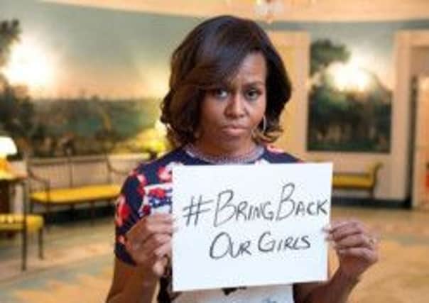 Michelle Obama holding a 'Bring back our girls' sign after the Boko Haram kidnapping received international condemnation. Picture: Contributed
