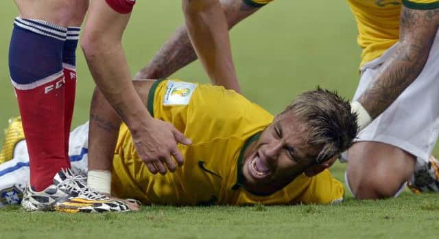 Brazil's Neymar screams out after being fouled during the quarter final between Brazil and Colombia. Picture: AP