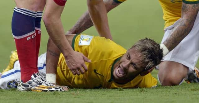 Brazil's Neymar screams out after being fouled during the quarter final between Brazil and Colombia. Picture: AP