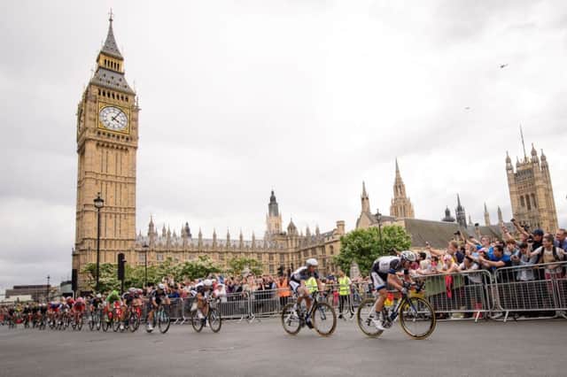 Riders pass the Palace of Westminster near the finish of the third stage between Cambridge and London. Picture: AFP
