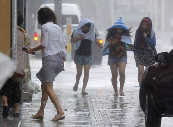 Okinawa was battered by the rain as the typhoon made its way across southern Japan. Picture: AP