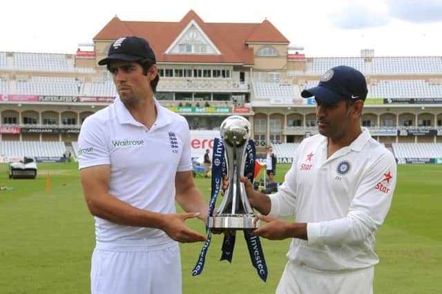 Skippers Alastair Cook and MS Dhoni pose with Pataudi Trophy which will be contested by England and India. Picture: AP