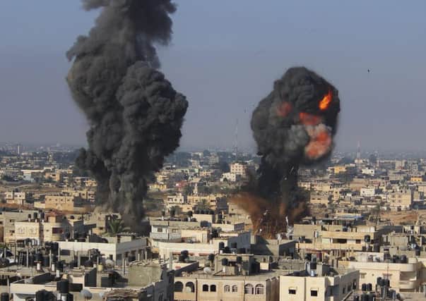 Smoke and flames visible following what police said was an Israeli air strike in Rafah. Picture: Reuters