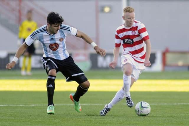 Hearts Callum Paterson challenges Hamiltons Ziggy Gordon for the ball during last nights friendly. Picture: John Devlin