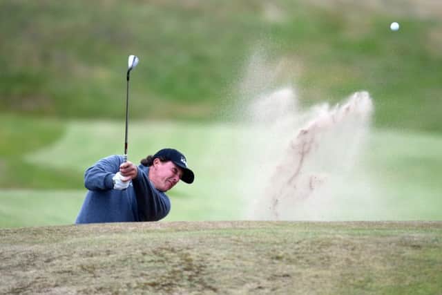 Phil Mickelson of the USA plays out of the bunker at the Scottish Open. Picture: SNS