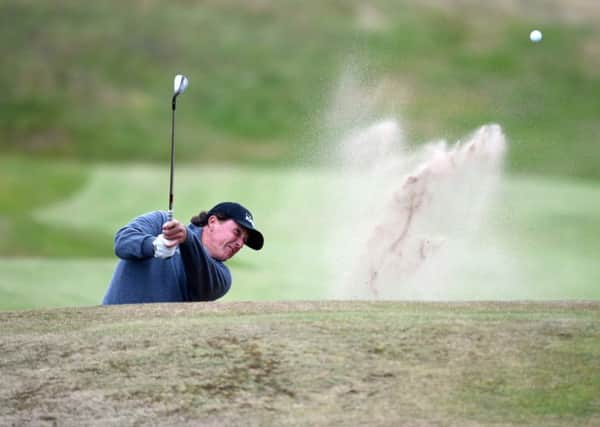 Phil Mickelson of the USA plays out of the bunker at the Scottish Open. Picture: SNS