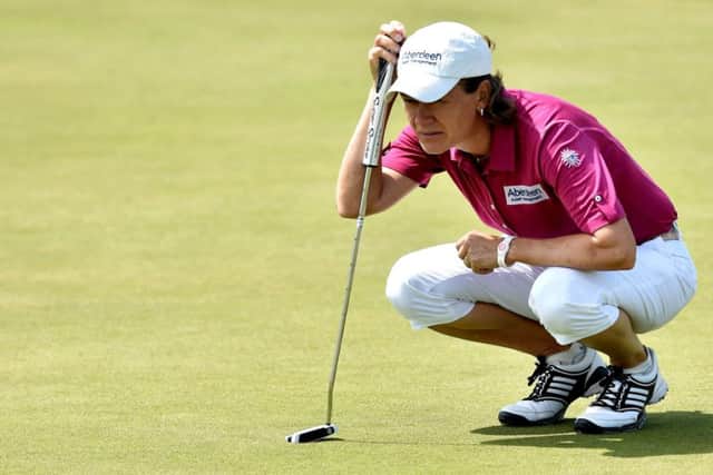 Catriona Matthew lines up a putt at the ninth green yesterday. Picture: Getty
