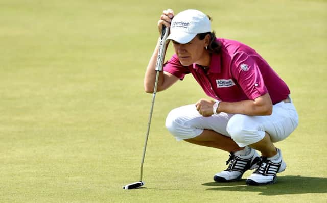 Catriona Matthew lines up a putt at the ninth green yesterday. Picture: Getty