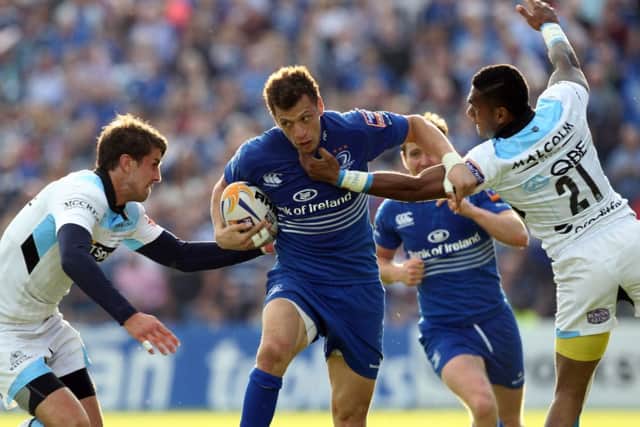 Peter Murchie and Niko Matawalu, of Glasgow, try to stop Leinsters Zane Kirchner during last seasons final. Picture: Getty
