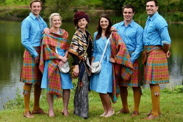 Designer and artist Jilli Blackwood (3rd left) joins Team Scotland athletes as they show off their new uniform. Picture: SNS