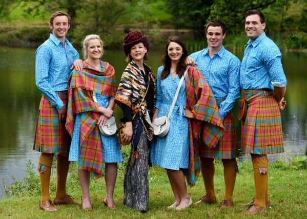 Designer and artist Jilli Blackwood (3rd left) joins Team Scotland athletes as they show off their new uniform. Picture: SNS