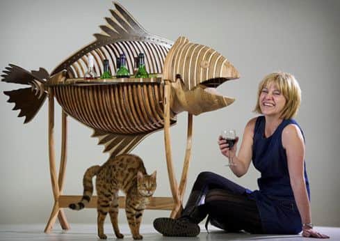 Cats out of the bag as Ali Wilson shows off the big fish drinks cabinet which won her Design Student of the Year. Photograph: Tony Marsh