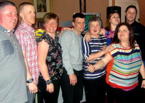 Sandra Maitland with John, far left, and her other six children at her 60th birthday party in 2012.