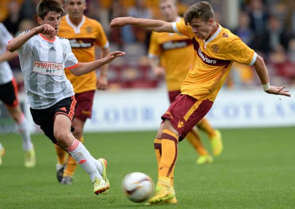 Motherwell kid Dom Thomas tries a shot on goal. Picture: SNS