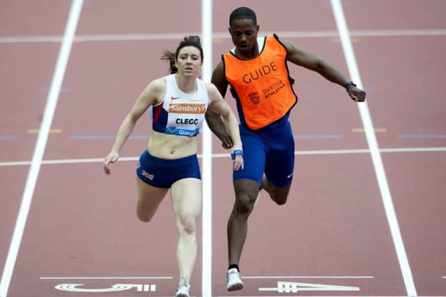 Scotland's Libby Clegg completes a personal best as she finishes third in the T12 i00m. Picture: SNS