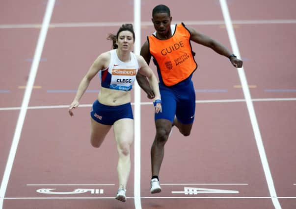 Scotland's Libby Clegg completes a personal best as she finishes third in the T12 i00m. Picture: SNS