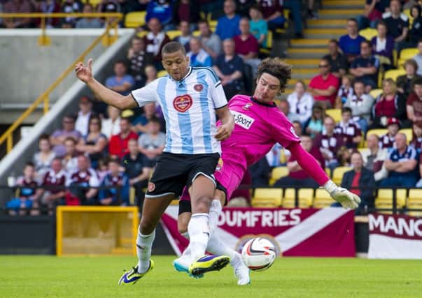 Silk purse out of a Sows ear: Osman Sow dispossesses East Fifes keeper Allan Fleming to score Hearts third goal. Photograph: Craig Foy
