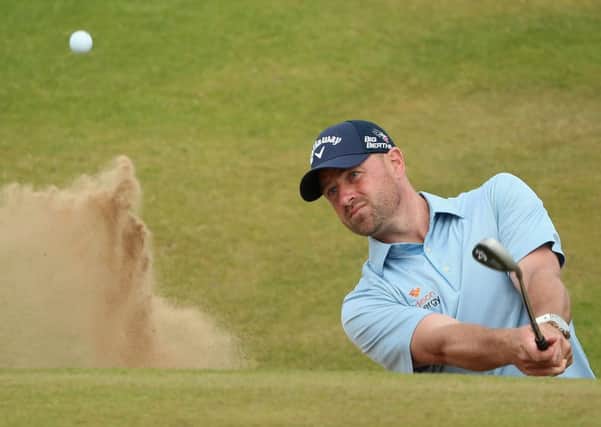 Craig Lee plays a bunker shot on the 16th hole during the Scottish Open at Royal Aberdeen yesterday on his way to an impressive 66 in trying conditions. Photograph: Andrew Redington