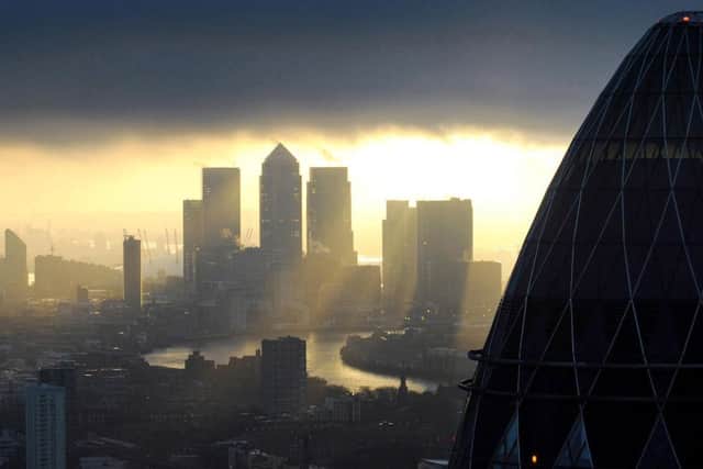 The Gherkin overlooks Canary Wharf in the City of London. Picture: PA