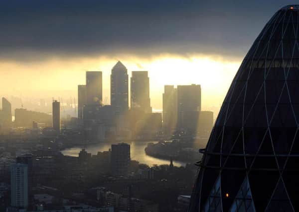 The Gherkin overlooks Canary Wharf in the City of London. Picture: PA