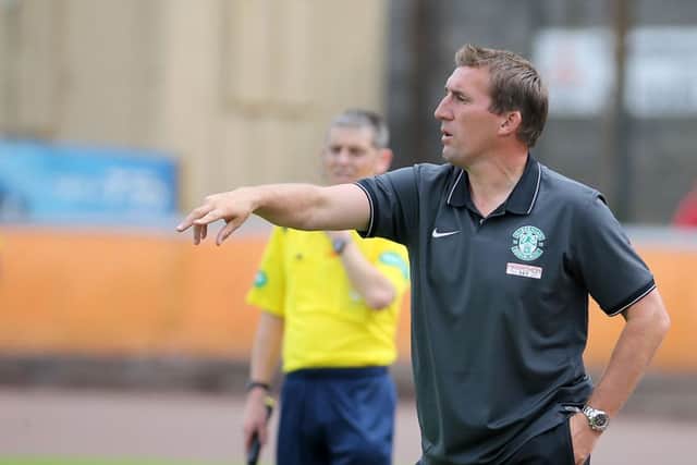 Hibernian manager Alan Stubbs urges his side on from the dugout. Picture: Gordon Fraser
