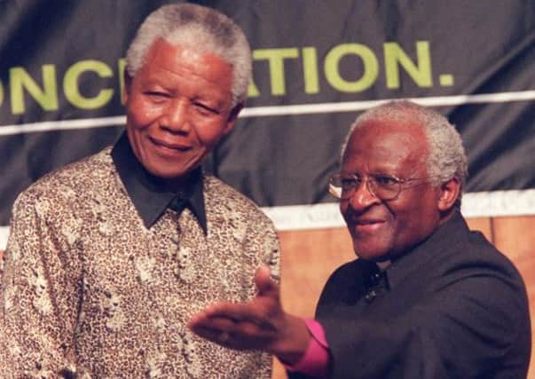 The late Nelson Mandela with his friend Archbishop Tutu. Picture: AP