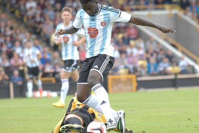 Hearts trialist Prince Buaben is tackled by Kevin Smith of East Fife during the Edinburgh teams 3-0  victory. Picture: Kevin Smith