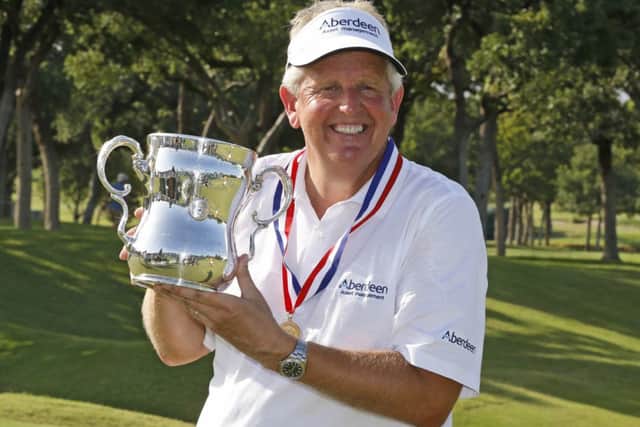 Colin Montgomerie poses with the Francis D. Ouimet Memorial Trophy after winning the U.S. Senior Open golf tournament at Oak Tree. Picture: AP