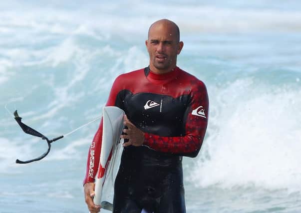 The very atoll Kelly Slater is sitting on could be underwater in a few short years. Picture: Getty