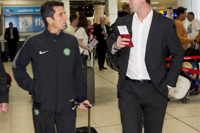 Celtic manager Ronny Deila, right, chats with assistant John Collins at Glasgow Airport. Picture: SNS