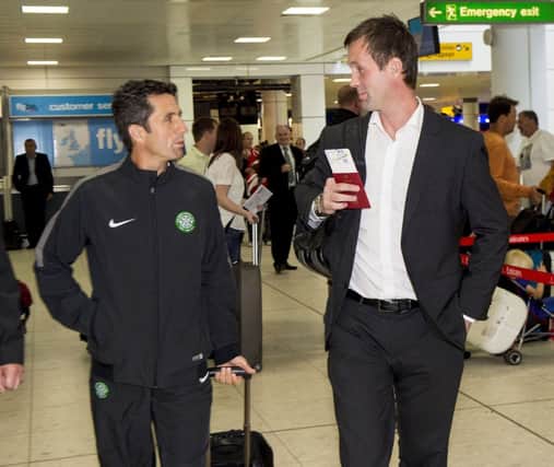 Celtic manager Ronny Deila, right, chats with assistant John Collins at Glasgow Airport. Picture: SNS