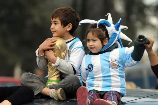 Young Argentina fans welcome the beaten finalists back to Buenos Aires yesterday. Picture: Getty