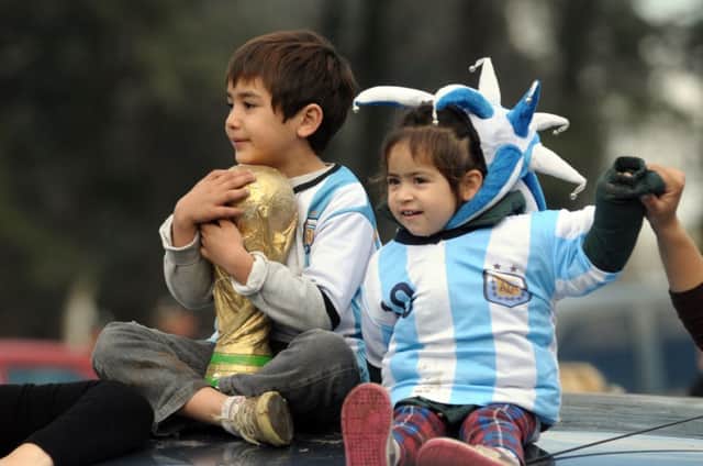 Young Argentina fans welcome the beaten finalists back to Buenos Aires yesterday. Picture: Getty