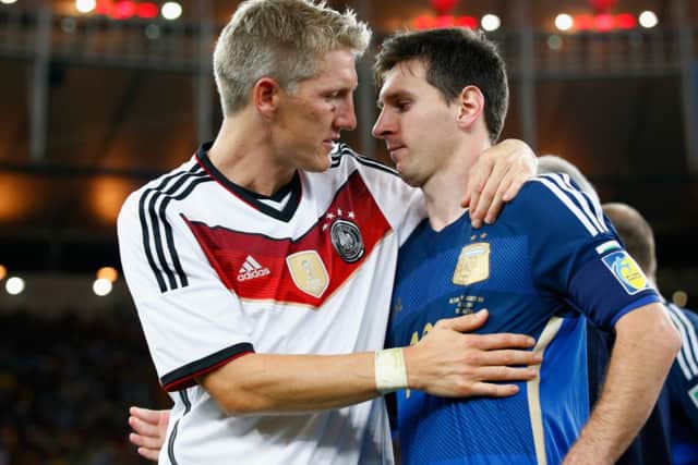 Bastian Schweinsteiger hugs Lionel Messi after Germany's 1-0 victory during the 2014 FIFA World Cup final. Picture: Getty