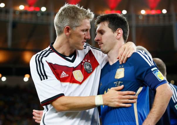 Bastian Schweinsteiger hugs Lionel Messi after Germany's 1-0 victory  during the 2014 FIFA World Cup final. Picture: Getty