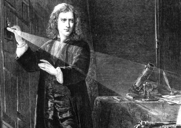 Sir Isaac Newton, creating a shaft of light, circa 1665. Picture: Getty