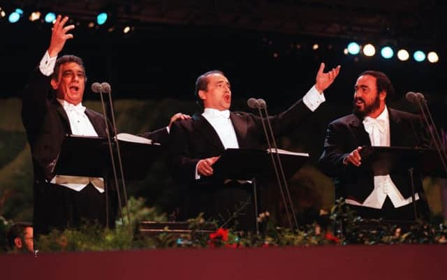 The Three Tenors  from left, Placido Domingo, Jose Carreras, and Luciano Pavarotti  sing at LAs Dodger Stadium in 1994. Picture: AP