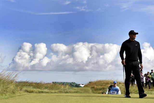 Tiger Woods is back at a major after missing the previous two with an injured back. Picture: PA